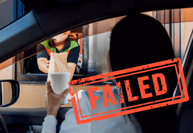 A woman getting food from a drive-thru chain with a failed stamp on her picture