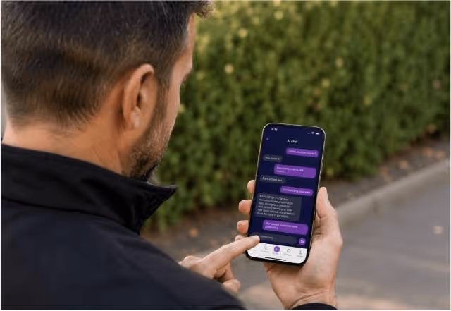 A driving instructor using a mobile app to manage lessons and pupil progress