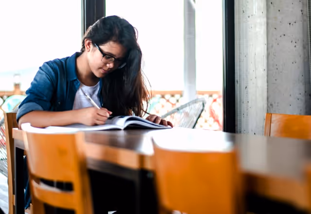 Girl at a cafe studying for theory test